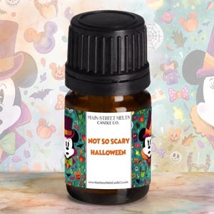 May include: A brown glass bottle with a black cap. The label reads "NOT SO SCARY HALLOWEEN" with a cartoon character in a Halloween costume. The background features a pattern of Halloween-themed illustrations.