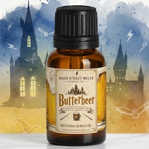 May include: An amber glass dropper bottle with a black cap and a cream-coloured label. The label features the text Main Street Melts Candle Co., Butterbeer, and Made with Magic and Muggle Care, along with illustrations of a castle, wands, and a mug.