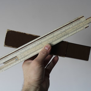logarithmic scale.Vintage Slide Rule with Case.Mathematics Engineering Science.Slide Rule.Calculating Rule.Ruler parallel lines.Sketching