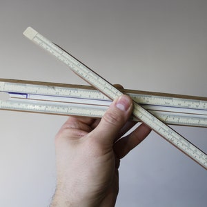 logarithmic scale. Vintage Slide Rule. Mathematics Engineering Science. Slide Rule. Calculating Rule. Ruler parallel lines. Sketching