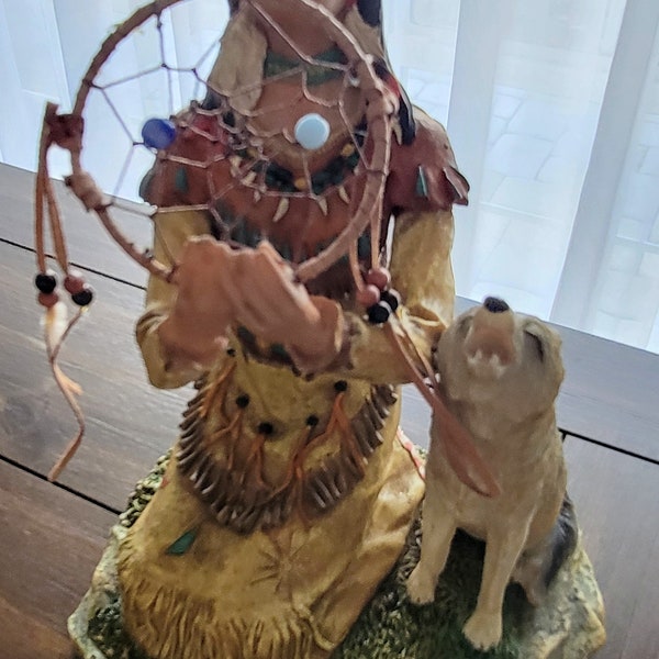 Indian maiden with wolf figure