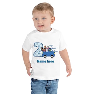 May include: White toddler t-shirt with a blue number 2, a blue truck with farm animals, and the text "Beep! Beep! Beep!" and "Name here".