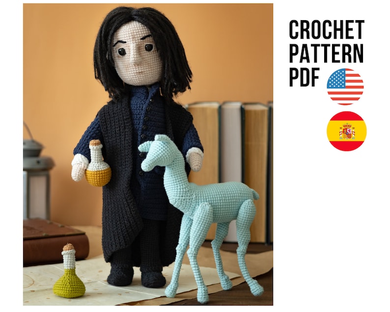 May include: Crochet pattern PDF for a black-haired doll with a long black robe, holding a small yellow bottle. The doll is standing next to a light blue crochet animal that resembles a deer.