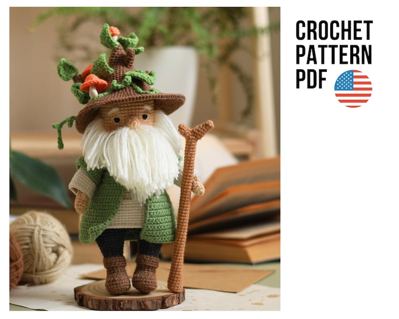 May include: Crochet pattern PDF for a green and brown gnome with a white beard and a mushroom hat. The gnome is holding a stick and standing on a wooden base.