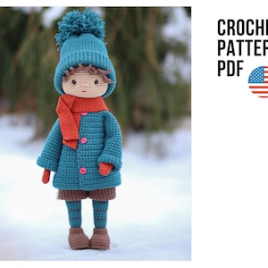 May include: A handmade crochet doll dressed in a teal coat, hat, and socks, with a bright orange scarf and brown shorts. The doll has a neutral skin tone and is standing in the snow. The text "CROCHET PATTERN PDF" is displayed.