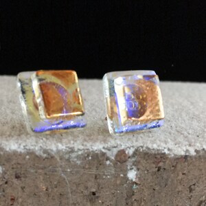 Handmade Purple Dichroic Glass studs with handpainted 24kt. golden swirls. 1/2"sq.Two layers of glass, one dichroic, the other gold swirl.