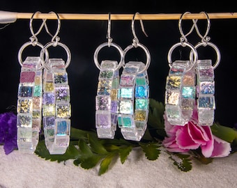 Subtle Colored Rainbow Hoops, handmade dichroic glass earrings, that reflect multi colors when they move. Four sizes 1/2", 1",1 1/2", 2"