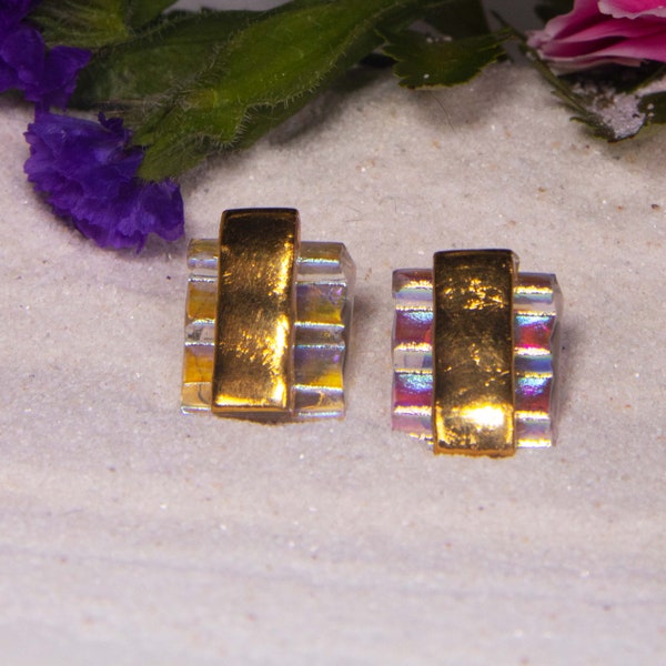 Handmade Dichroic Glass earrings, with gold bars laid over pink ribbed dichroic glass. 5/8 x 5/8