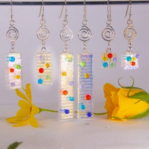 Tiny Drops, handmade dichroic glass earrings, that show off the tiny colored drops. Three sizes 1/2, 1, 2&quot;.  Please see the other photos.