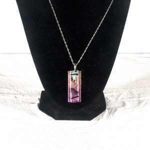 Handmade fused glass pendent "Lantern" made with black lines over dichroicr.1 1/4x 1/2"