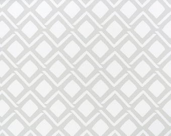 May include: White fabric with a repeating geometric pattern of gray diamonds. The fabric is measured in inches.