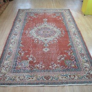 Vintage Handwoven Turkish Rug: Low Pile Wool Carpet (9 x 5.7 ft)