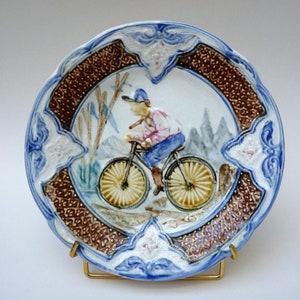 Wasmuel Art Nouveau barbotine bord plate man on bike