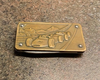 Vintage geldclip raceauto met open wiel van Imperial