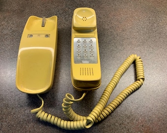 Vintage trim line telephone phone handset in yellow push button