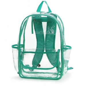 May include: Clear plastic backpack with teal trim. The backpack has a large main compartment, a smaller front pocket, and two side pockets. The straps are adjustable.