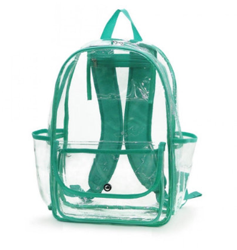 May include: Clear plastic backpack with teal trim. The backpack has a large main compartment, a smaller front pocket, and two side pockets. The straps are adjustable.