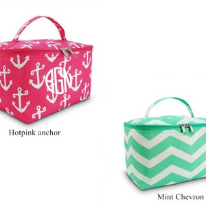 May include: Two cosmetic bags, one hot pink with white anchors and the letters "AGK" in white, and one mint green with a white chevron pattern. Both bags have a zipper closure and a top handle.