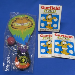 Vintage Garfield Paddle Ball and Collectible Band Aids