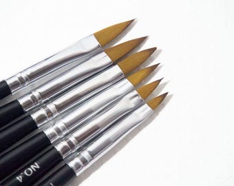 May include: A set of six angled paint brushes with black handles and silver ferrules. The brush tips are a light brown color. The handles are labeled with the number 4.