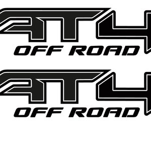 May include: Two black and white decals with the text "AT4 OFF ROAD" in a bold, stylized font. The decals are officially licensed by General Motors.