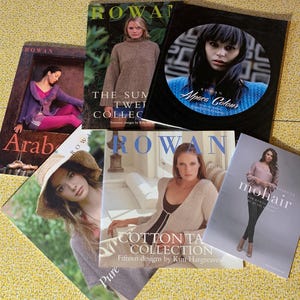 May include: A collection of six Rowan knitting pattern books featuring various designs, including titles such as Arabesque, The Summer Twelve Collection, Alpaca Colour, Cotton Tape Collection, and Mohair Projects, all displaying photography of knitwear.