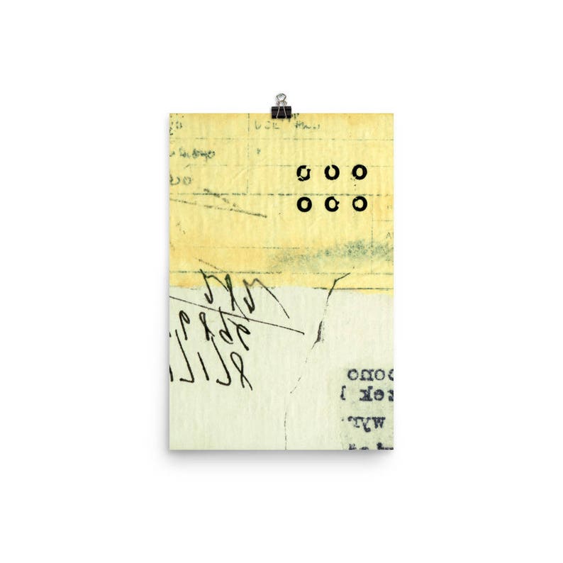 May include: A yellowed, textured paper with black ink markings and a series of black circles arranged in a grid pattern. The paper has a torn edge and appears to be a fragment of a larger document.