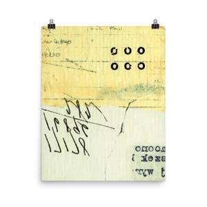 May include: A yellowed piece of paper with black ink markings. The paper has a faded, vintage look. The text on the paper is "goo" and "ooo".