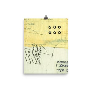 May include: A yellowed piece of paper with handwritten text and a series of black circles. The text includes the word "good" and a series of numbers. The paper is torn and has a faded appearance.