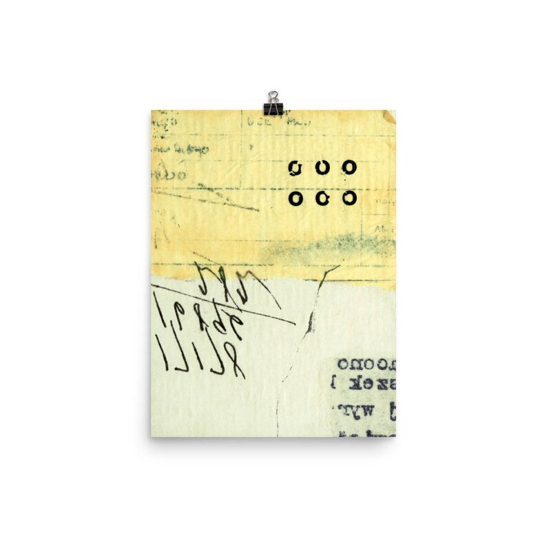 May include: A yellowed piece of paper with black ink markings and a series of black circles arranged in a grid pattern. The paper has a distressed, vintage look.