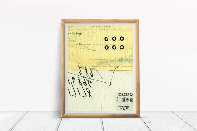May include: A framed abstract art print with a yellow background and black text. The text includes the letters "OOO" and "OXO".