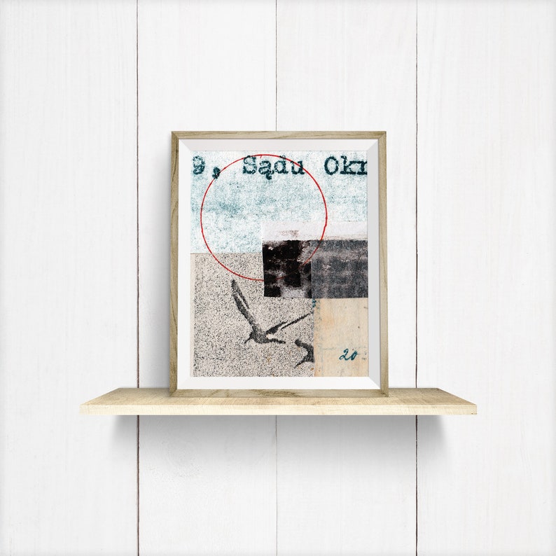 May include: A framed abstract art print with a red circle, a black square, and a bird silhouette on a beige background. The text "Sagu Okr" is visible in the top right corner.