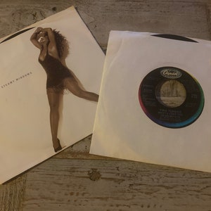 Vintage 1980’s Tina Turner 45RPM Lot of (2) What’s Love Got to Do With It - Rock N Roll Widow - Steamy Windows - The Best