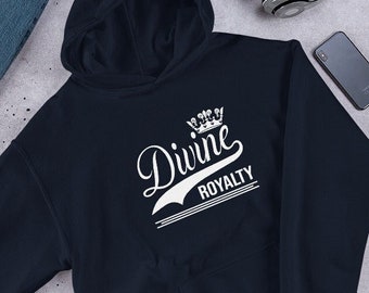 May include: Navy blue hooded sweatshirt with a white graphic that says "Divine Royalty" with a crown above the word "Divine".