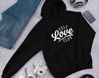May include: Black hooded sweatshirt with white text that reads "SELF LOVE CLUB" in a stylized font.