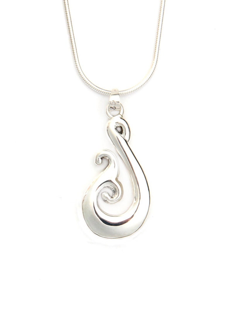 Maori Matau with silver necklace