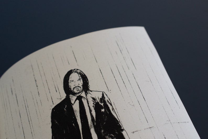 May include: Monochrome illustration of a man in a suit, with long hair and a beard, set against a white backdrop with vertical lines. The image is a close-up, showing the man's face and upper body.