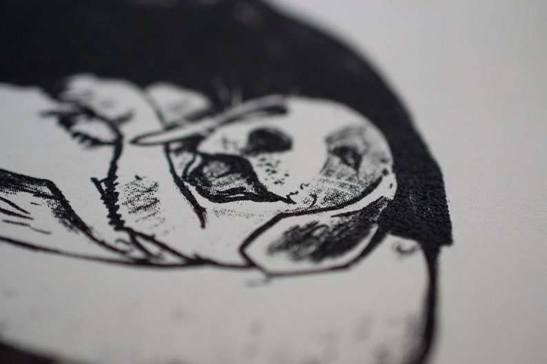 May include: A monochrome illustration of a dog's face, with a focus on the eyes and ears. The artwork is detailed, with visible shading and texture, and is set against a white background.