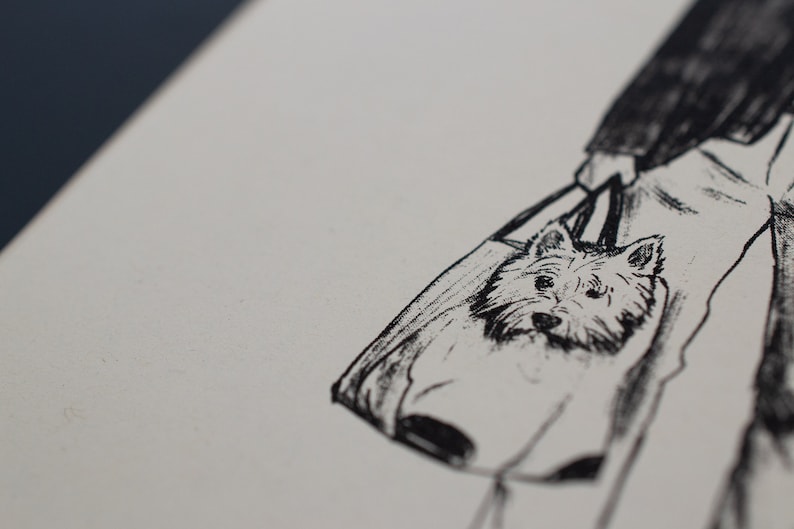 May include: A monochrome illustration of a tote bag with a dog's face design. The bag is held by a person, with the dog's head visible. The artwork is detailed, focusing on the dog's features and expression.