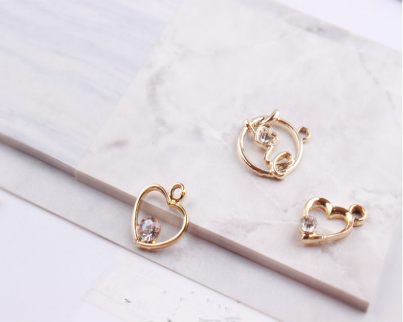 10Pcs Gold Hollow Geometric Charm Pendant,Crystal Heart TriangleRound Charms for Earring Bracelet Necklaces Pendants for DIY Findings