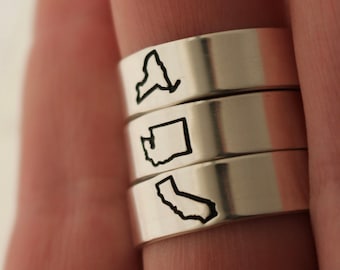Anillo con el contorno de un estado de EE. UU.: Regalo de plata de ley para viajes a larga distancia.
