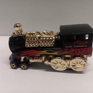 Hot wheels rail rodder train in mint condition diecast car.