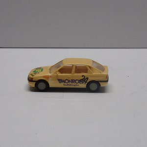 Ford escort ghia praline car 1:87th  plastic Car made in west germany.  made in 1990s