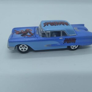 Johnny lightning ford thunderbird spider man diecast car.