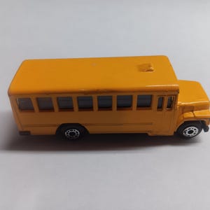 Matchbox 1985 school bus diecast car.