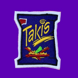 May include: A blue and white embroidered patch of a Takis bag with the Takis logo and a red, green, and yellow design.