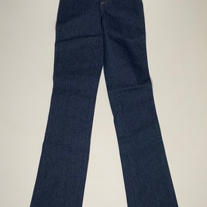 May include: A pair of dark blue denim jeans with a straight leg and a high waist.