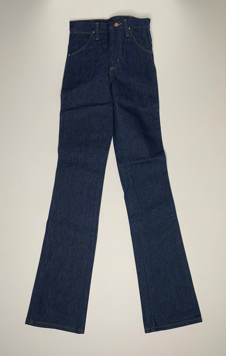 May include: A pair of dark blue denim jeans with a straight leg and a high waist.