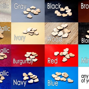 May include: A selection of wooden heart shapes in various colors, including silver metallic, gray, black, brown, gold metallic, ivory, wood, black wood, rose metallic, burgundy, red, mint, blue metallic, navy, and blue. The hearts are arranged in a grid pattern on different colored backgrounds.