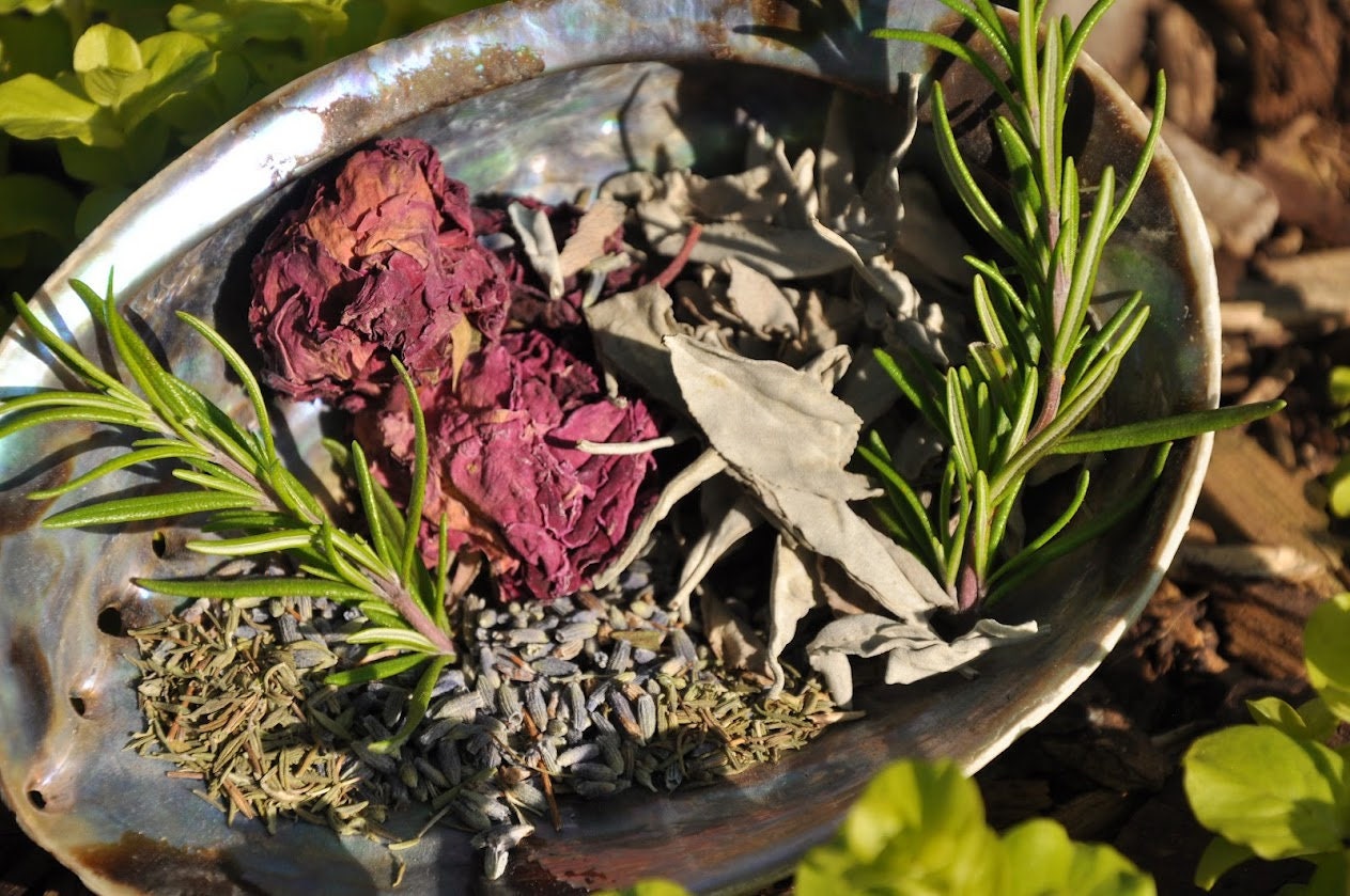 eautiful bundle of witchcraft cleansing herbs including sage, rosemary, and rose